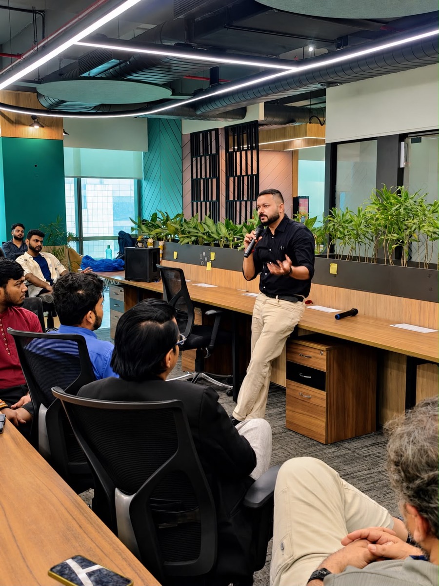 A speaker addressing founders during a Bizowl session at a coworking space